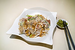 Fried Kuey Teow with beef, popular in Malaysia photo
