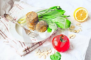 Fried lentil patties with garlic and herbs, white background, to