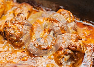 Fried meat, in a frying pan