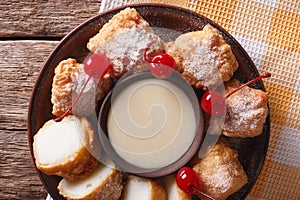 Fried milk dessert with condensed milk close-up. horizontal top