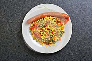 Fried mixed vegetables and sausage