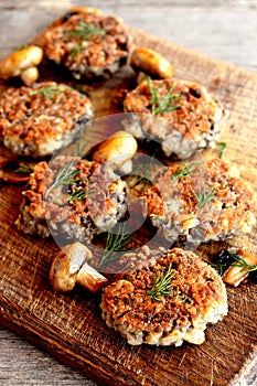 Fried mushroom burgers with onion on a plate. Homemade mushroom cutlets
