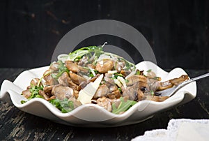 Fried mushrooms with vegetables on a plate