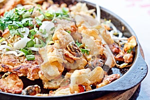 Fried mussel pancake in hot pan