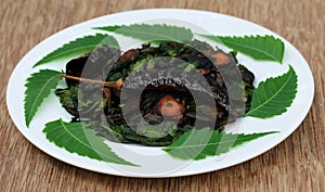 Fried neem leaves