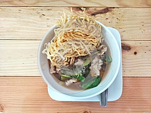 Fried noodle with pork and kale soaked in gravy