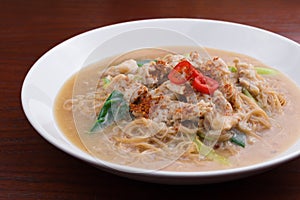 Fried noodle with pork and vegetable. Thai-Chinese noodle dish `Rad Na`