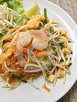 Fried noodle Thai style with prawns, Stir fry noodles with shrimp in Pad Thai , Thai noodle style, Traditional food.