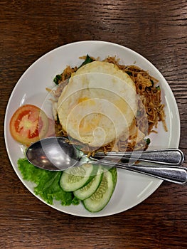 Fried noodles with sunny egg and vegetables