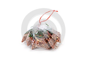 Fried nuts in plastic bag package isolated