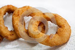 Fried onion rings on the paper