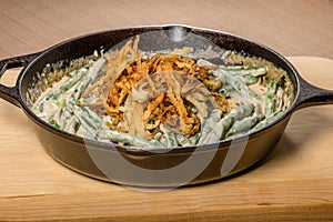 Fried onions with beans in a cast iron skillet
