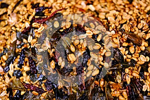 Fried peanut with chilly pepper - traditional asian street food