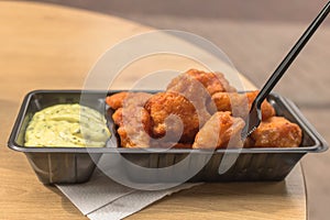 Fried pieces of fish, called kibbeling, with tasty remoulade sauce.