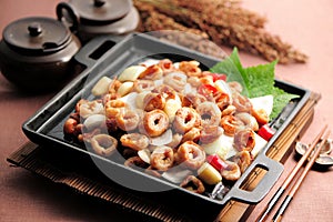 Fried pig intestines in Korean style on black pan