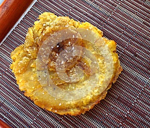 Fried plantain tostones (patacones) photo