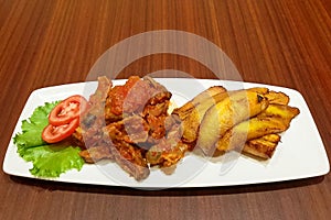 Fried plantains and gizzard stew with fresh tomatoes - Nigerian food - Delicacy