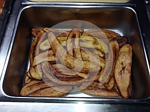 Fried plantains in stainless steel bowl