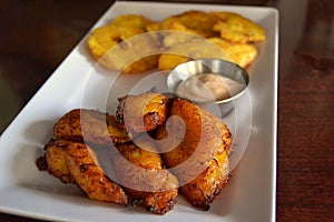 Fried plantains and tostones with dipping sauce