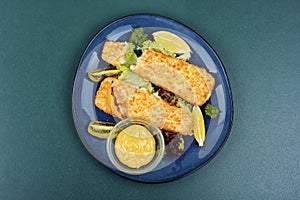 Fried pollock fillets with breadcrumbs