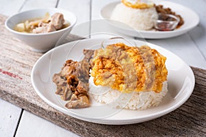 Fried Pork with Garlic, Pepper and fried egg on rice. Easy thai food