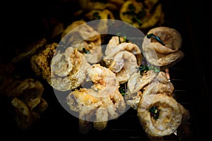 Fried pork intestines on a food stall in flea market at Nakhon Sawan Province