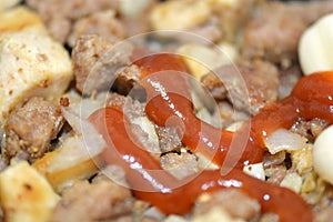 Fried pork liver with tomatoes and potatoes