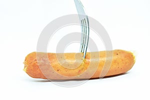Fried pork sausage stabbing by silver fork on white background