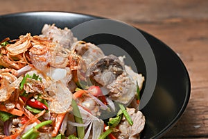 Fried Pork Spare Ribs With Garlic And Pepper Mix With Spicy Salad In Bowl