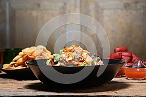 Fried Pork Spare Ribs With Garlic And Pepper Mix With Spicy Salad In Bowl