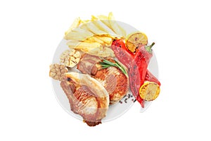 Fried pork steaks and vegetables isolated on background. Grilled food