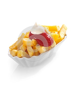 Fried potato chips with ketchup and mayo