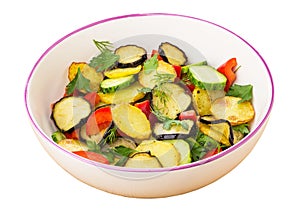 Fried potato and eggplant, cucumbers, sweet pepper and greens in bowl isolated on white