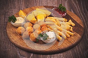 Fried potato platter with dips