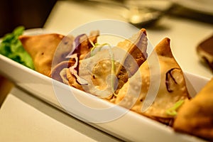 Fried potato samosa appetiser in Indian restaurant photo