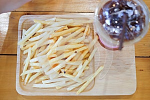 Fried potato sticks served with ice drink