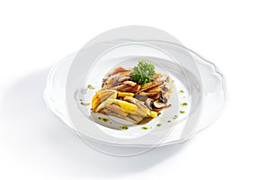 Fried Potatoes with Mushrooms on a Restaurant Plate Isolated