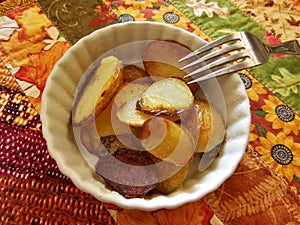 Fried Potatoes in a Small dish with a Fork