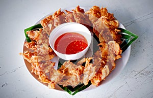 Fried prawn balls on white wooden table