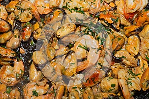 Fried prawns and mussels. grilled seafood close up