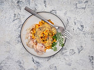 Fried pumpkin in sour cream sauce and chicken fillet slices for a healthy diet