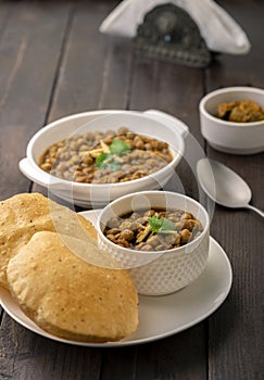 Fried Puri and Chole ki sabzi - famous Indian food photo