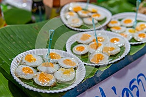 Fried quail eggs for sale at Thai market