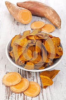 Fried and raw red batata chips photo
