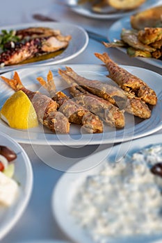 fried red mullet fish plate on table