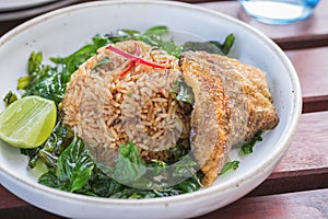 Fried rice with basil and crispy fried fish sliced, Thai food