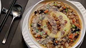 Fried Rice in Braised Abalone Sauce with Conpoy, Chicken and Dried Shrimp, Cantonese Cuisine in Bangkok.