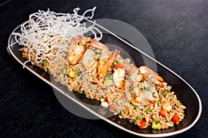 Fried rice with calamari - asian food. chaufa rice with shrimp photo