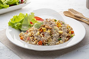 Fried Rice with canned Tuna fish.Quick and Easy Thai style spicy one dish meal on white plate