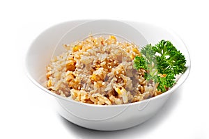 Fried rice with egg. Rice with omelette on a white background